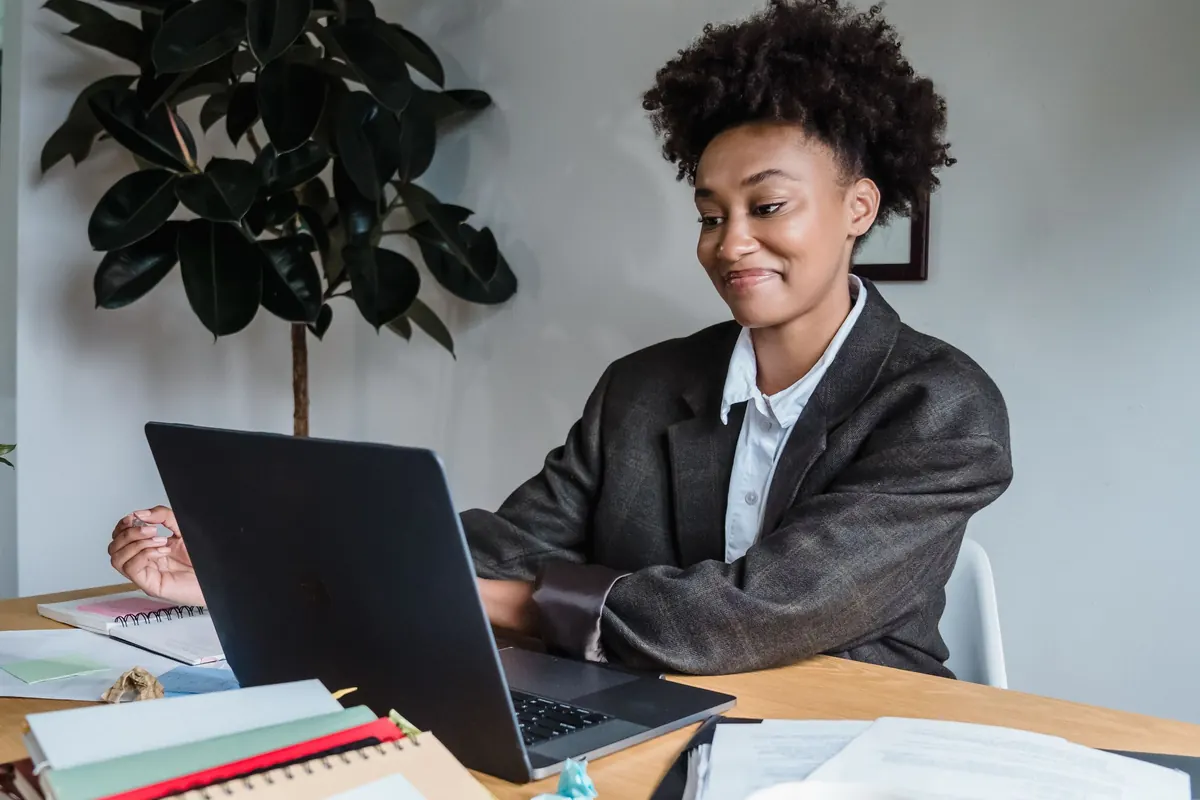 A relieved woman smiling while completing her divorce forms online